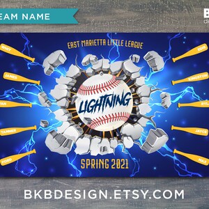 May include: A blue and white baseball team banner with the words "East Marietta Little League" and "Lightning" printed on it. The banner features a baseball breaking through a wall with lightning bolts and the names of the team members printed around the baseball.