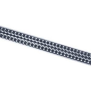 May include: A silver trim with a repeating pattern of small circles and wavy lines.
