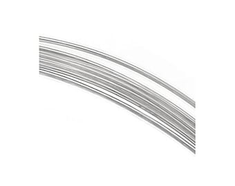 May include: A close-up of a bundle of silver wire. The wire is thin and shiny, and it is coiled together in a loose spiral.