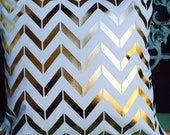 Mini chevron meets herringbone in Gold or foil on a toss pillow in white or ivory cotton blend with the insert