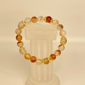 Cherry Agate Beads with gold toned Flower spacers - 6 inch Elastic Bracelet