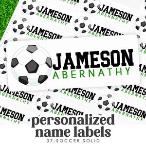 May include: White rectangular personalized name labels with a soccer ball graphic. The labels feature the name "JAMESON ABERNATHY" in black and green. The words "personalized name labels" and "07-SOCCER SOLID" are also visible.