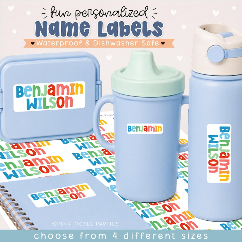 May include: A collection of personalized name labels featuring the text Benjamin Wilson in colorful, rounded letters. The labels are applied to a light blue lunch box, a light blue sippy cup, a light blue water bottle, and a spiral-bound notebook.