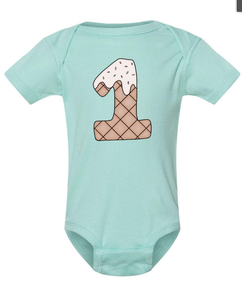 May include: A light blue baby onesie with a graphic of the number one shaped like an ice cream cone with sprinkles on top.