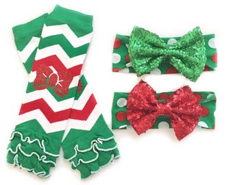 May include: A set of two green and red chevron leg warmers with a red bow applique and two green and white polka dot headbands with red and green sequin bows.