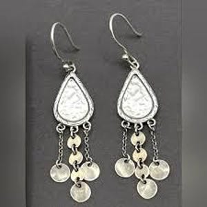 May include: A pair of silver-toned dangle earrings. Each earring features a teardrop-shaped hammered metal top with a chain of small, round, dangling charms. The earrings have a hook closure.