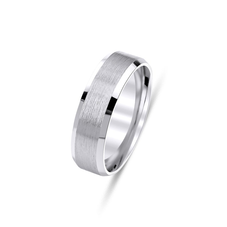 May include: A brushed silver wedding band with a beveled edge.