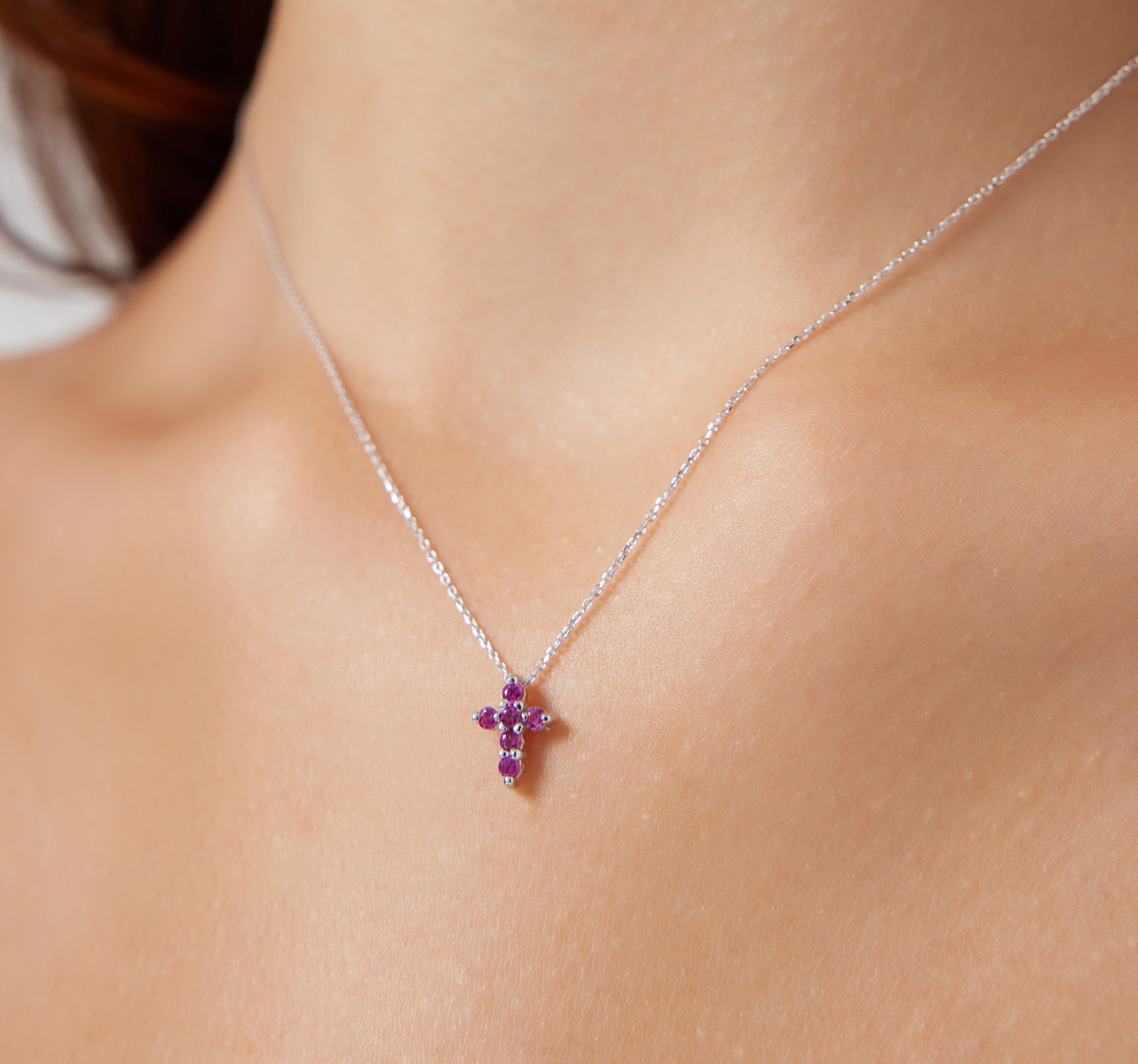 Gold ruby cross best sale pendant
