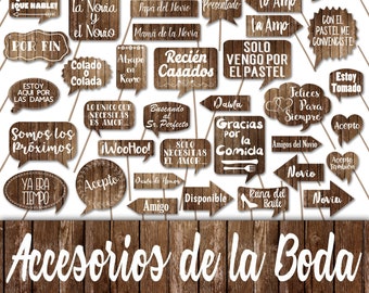 May include: A set of 24 rustic brown wooden photo booth props with white text. The props feature phrases and sayings related to a wedding, such as "Salud para la Novia y el Novio", "Recién Casados", "La Mejor Boda del Mundo", and "Solo Vengo por el Pastel".