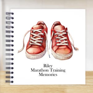 May include: Red running shoes with white laces and a white sole. The shoes are on a white background with the text "Riley Marathon Training Memories".
