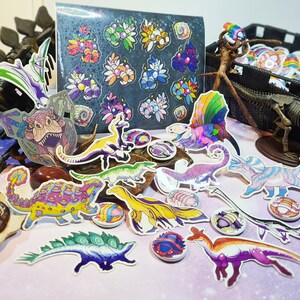 May include: A collection of colorful dinosaur stickers featuring a variety of species, including a stegosaurus, triceratops, and a pterodactyl. The stickers are on a purple and blue background with a dinosaur skeleton and a fossil.
