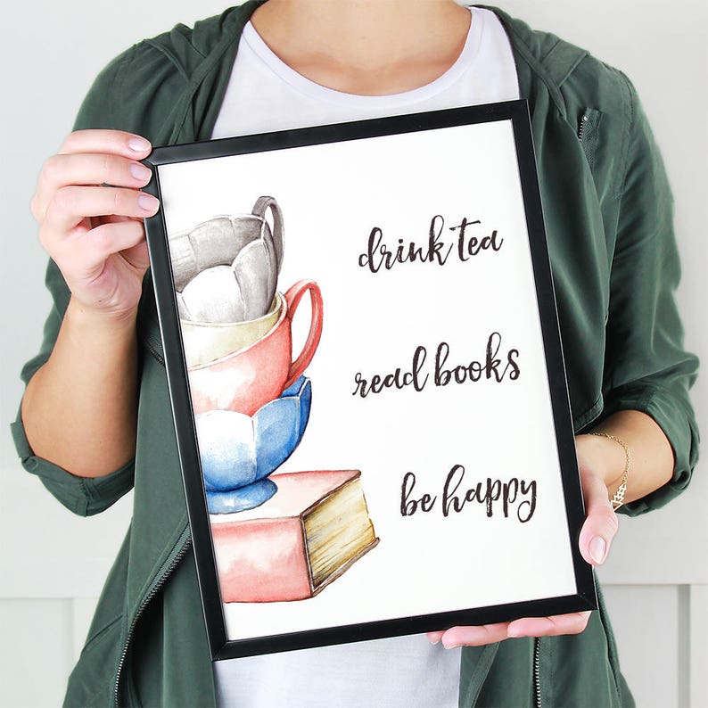 May include: A watercolor illustration of stacked teacups and a book with the text "drink tea read books be happy".