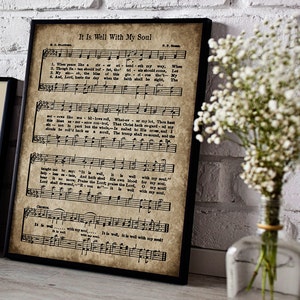 May include: Vintage sheet music with the title "It Is Well With My Soul" printed in black text on a cream-colored background. The sheet music features musical notes and lyrics for the hymn.