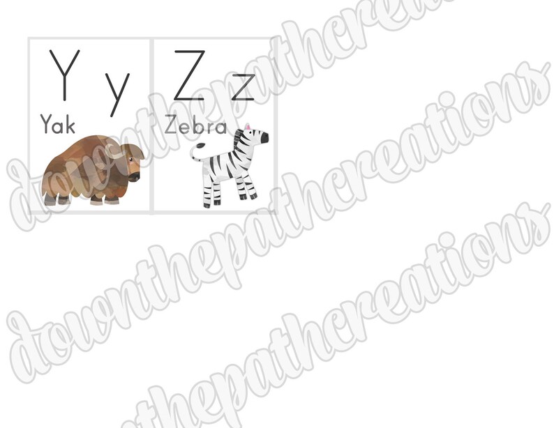 May include: A printable alphabet flashcard set featuring the letters Y and Z. The letter Y is paired with a brown yak and the letter Z is paired with a black and white zebra.