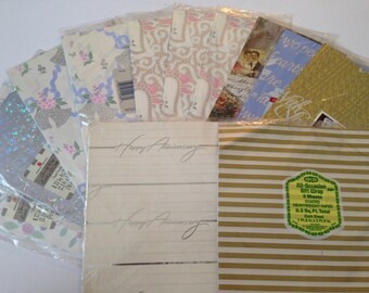 May include: A collection of gift wrap paper featuring various patterns and designs, including floral, paisley, and geometric. The paper is packaged in a clear plastic sleeve and includes two sheets of heavyweight paper, each measuring 8.3 square feet. The text "Happy Anniversary" is printed on two of the sheets.