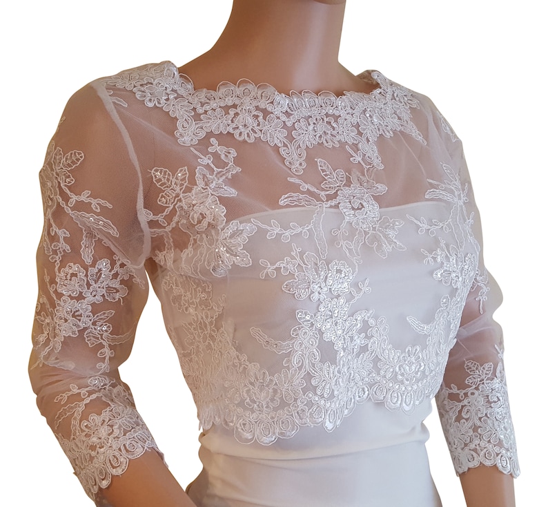 v back bolero with 34 length sleeves with a button fastening detail back size UK 8-18 fullly lined Pale Ivory cropped sequined lace