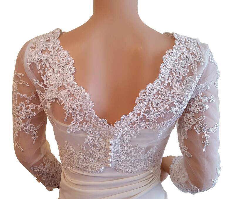 v back bolero with 34 length sleeves with a button fastening detail back size UK 8-18 fullly lined Pale Ivory cropped sequined lace
