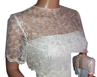 Boléro en dentelle nuptiale en blanc avec un cropped top et un dos fendu. Royaume-Uni 8 à 18 tailles