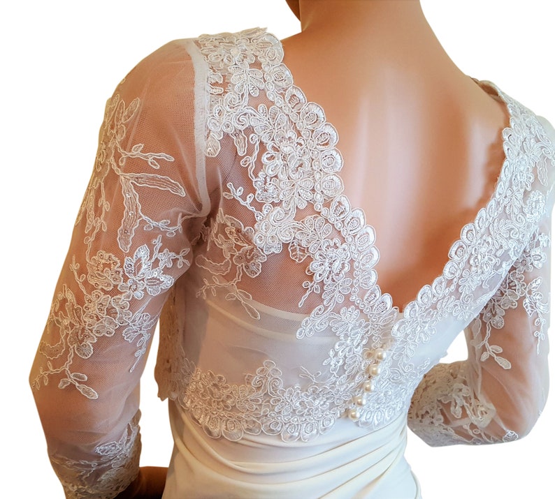 v back bolero with 34 length sleeves with a button fastening detail back size UK 8-18 fullly lined Pale Ivory cropped sequined lace