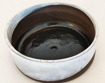 simple flat shell, black-brown clay, white and transparent glaze