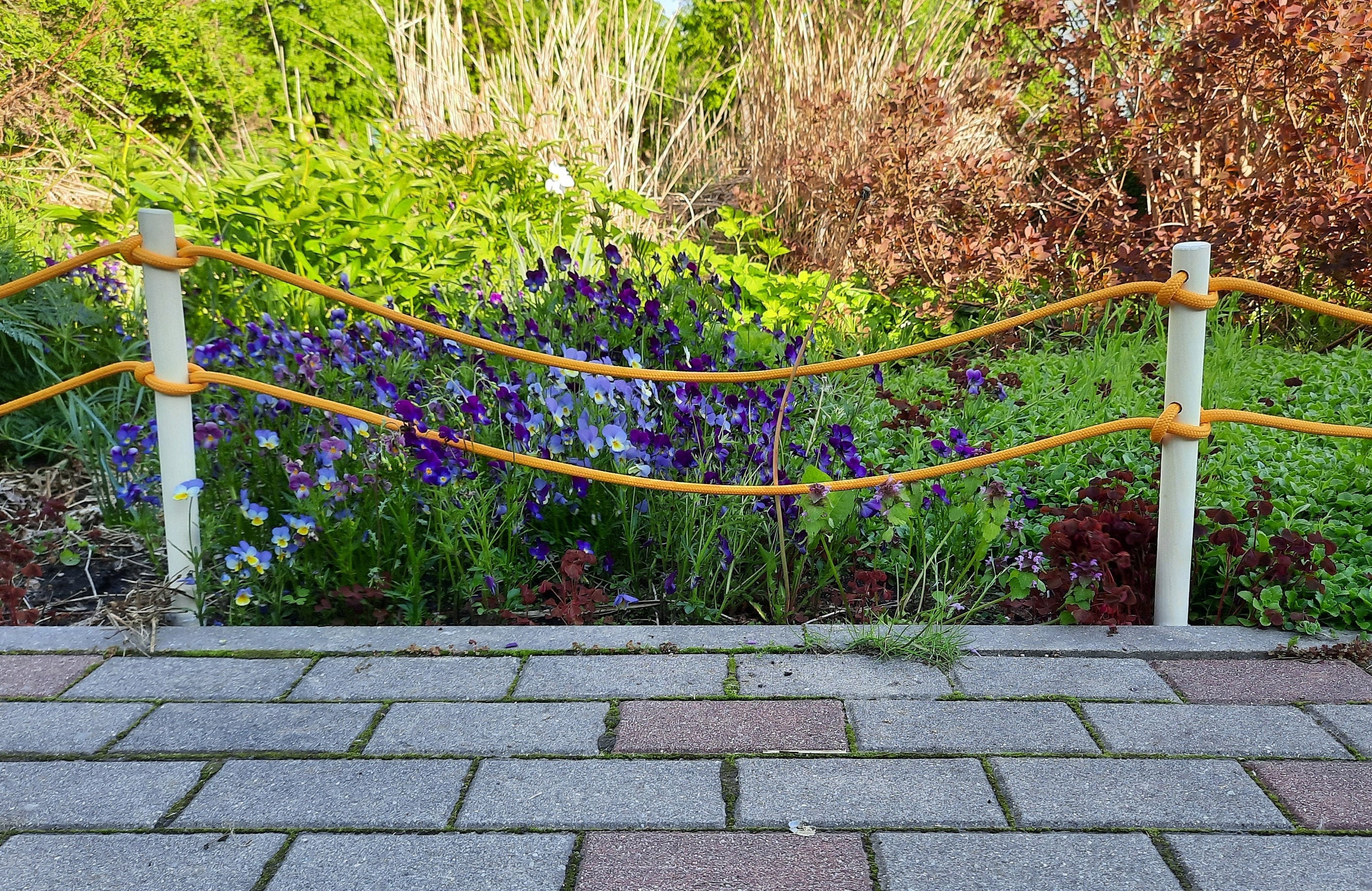 Personaliza tus vallas de madera para tener un jardín original