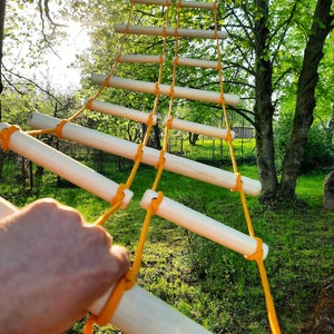 Unique rope ladder for kids and adults, interspersed larger and smaller rungs with metal mounts on both ends