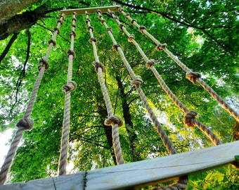 Climbing rope wall, row of climbing ropes with knots