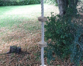 Climbing rope with plywood pucks