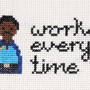 May include: Cross-stitch embroidery of a cartoon character with the text "works every time".