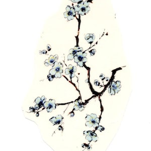 May include: A floral design featuring a branch with white blossoms and blue centres. The artwork is on an off-white background, with dark brown branches and stems. The design has a watercolor or painted aesthetic.