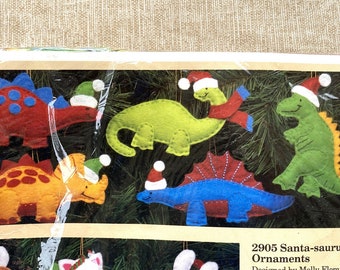 Vintage dinosaurs felt ornaments kit, Creative Circle 2905, unopened package dated 1988, DIY Santa-saurus Christmas ornaments kit