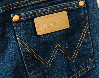 Jeans Wrangler anni '80 in denim scuro a gamba dritta, vita 33".
