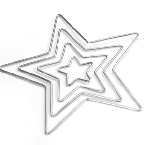 May include: A nested star-shaped wireframe design. The silver-colored metal forms five stars of decreasing size, creating a layered effect. The object is set against a plain white background.