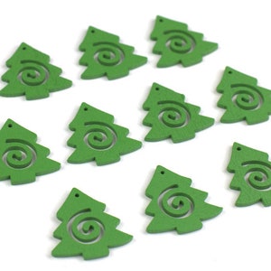 May include: Ten green wooden Christmas tree ornaments with a spiral design cut out. The ornaments are approximately 2 inches tall.
