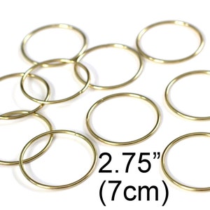 May include: Ten gold jump rings, each measuring 2.75 inches (7 cm) in diameter.