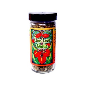 May include: A clear glass jar of garlic seasoning with a black lid. The label features the text "One Love Garlic" in a heart-shaped design with red and green accents. The jar is filled with a mix of herbs and spices.
