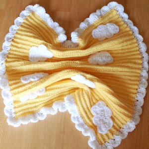 Yellow baby blanket with clouds