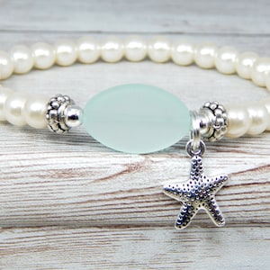 Pulsera de cristal marino: Joyería de perlas con dije de estrella de mar de plata.