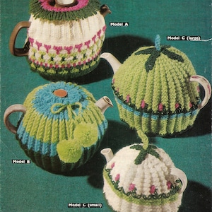 May include: Four knitted teapot cozy patterns, labeled Model A, Model B, Model C (large), and Model C (small). The cozies are in various colors, including white, green, blue, and pink.