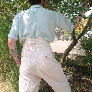 1930s 1940s natural linen extreme high waisted trousers with fishtail back and pleated front