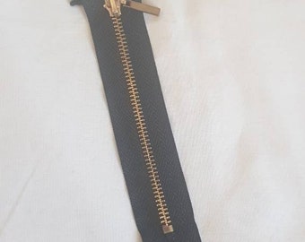 Black 6 inch zipper with gold metal teeth