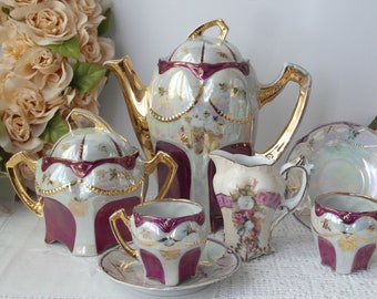 Antique Tete-a-Tete demitasse porcelain set for two with purple and gold decoration for mocha coffee hot chocolate etc. Hand painting around 1850