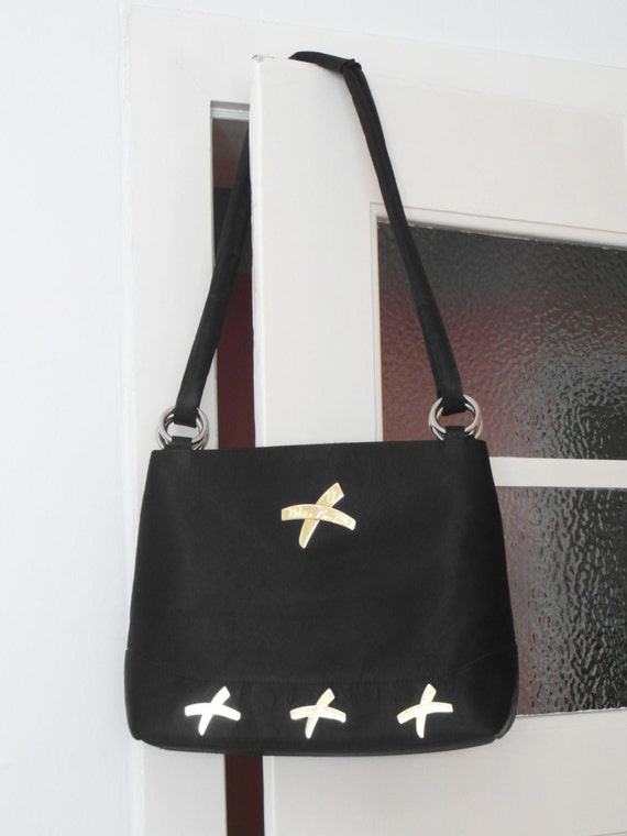 Black vintage women's bag with gold-colored desig… - image 1