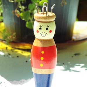 Old knitting doll cheerful wooden doll traditional costume doll handmade red blue painted image 5