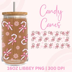 May include: A clear glass tumbler with a wooden lid and a silver straw. The tumbler features a brown background with pink candy canes and snowflakes. The words "Candy Canes" are written in pink script. The tumbler is 16oz.