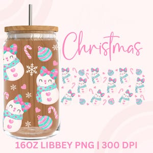 May include: A clear glass tumbler with a wooden lid and a stainless steel straw. The tumbler is decorated with a repeating pattern of snowmen, candy canes, and ornaments in pink and teal. The word "Christmas" is written in pink script.