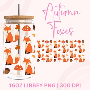 May include: A clear glass tumbler with a wooden lid and a silver straw. The tumbler is decorated with orange foxes, mushrooms, and autumn leaves. The text "Autumn Foxes" is written in pink script. The bottom of the image reads "16oz Libbey PNG | 300 DPI".