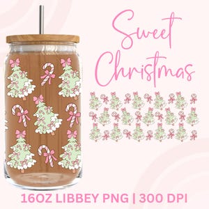 May include: A glass tumbler with a bamboo lid and a metal straw, decorated with a festive Christmas tree and candy cane pattern. The words "Sweet Christmas" are written in pink script. The tumbler is designed to hold 473 ml of liquid.