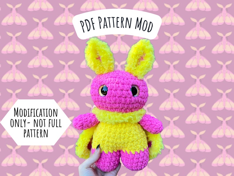 May include: PDF pattern mod for a crocheted pink and yellow moth amigurumi toy. The pattern is for a modification only, not a full pattern.