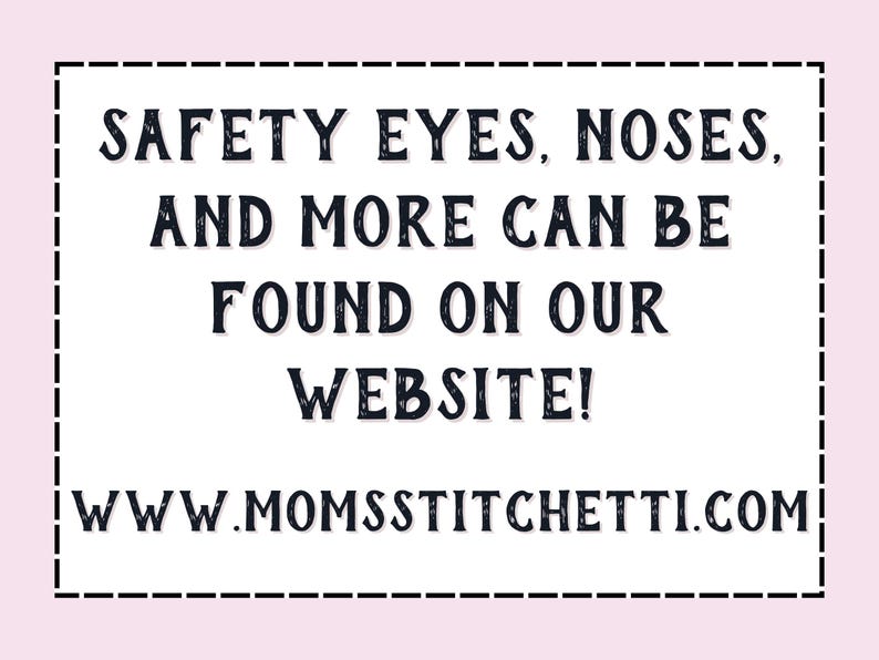 May include: A white sign with black text that reads "SAFETY EYES, NOSES, AND MORE CAN BE FOUND ON OUR WEBSITE! WWW.MOMSSTITCHETTI.COM".